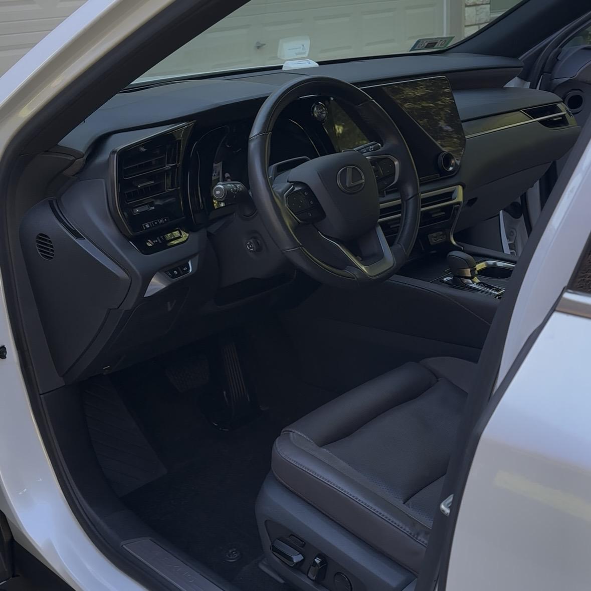 Clean and detailed car interior showing spotless seats and dashboard